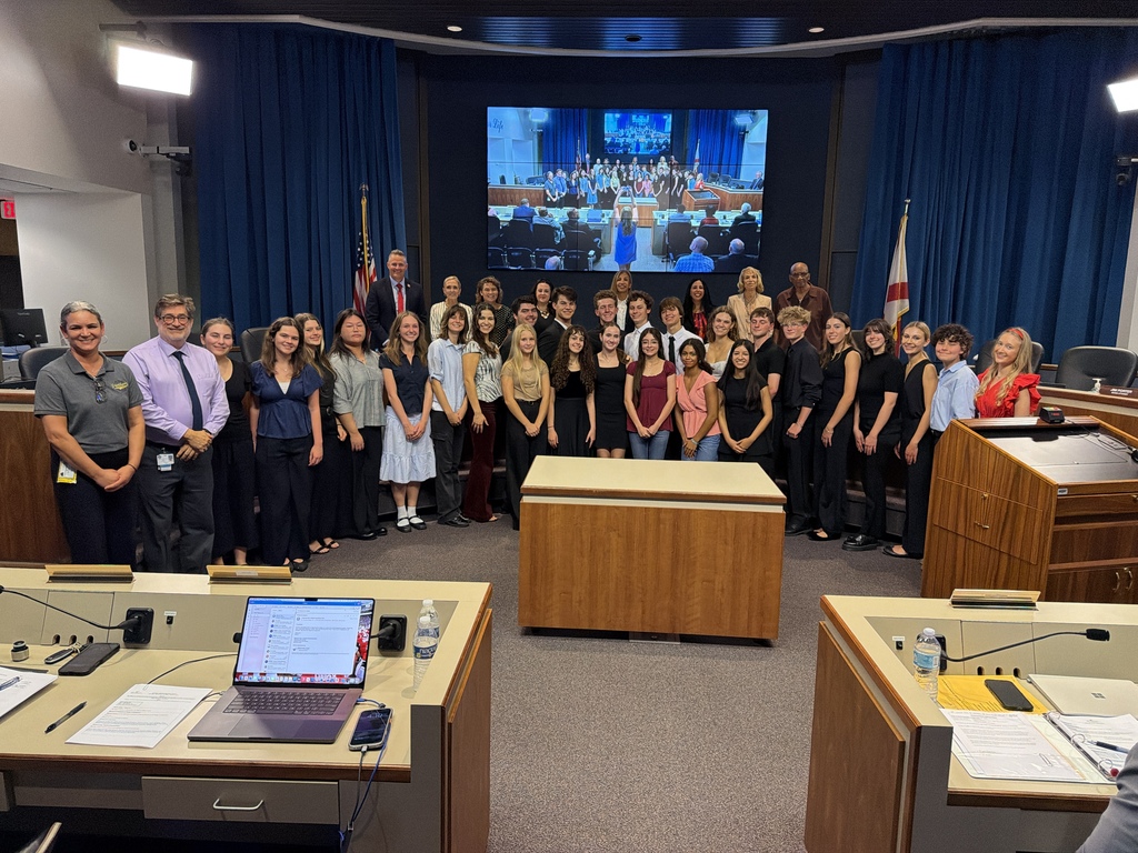 Plant High School orchestra in photo with school board