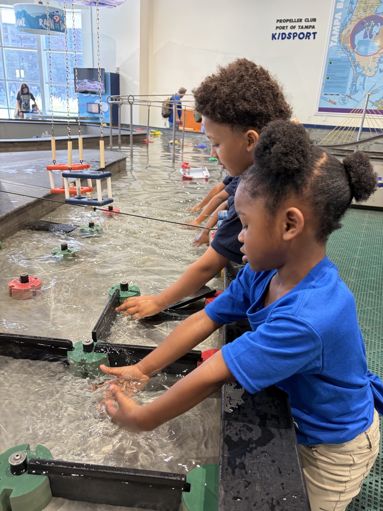 Two young students playing in water