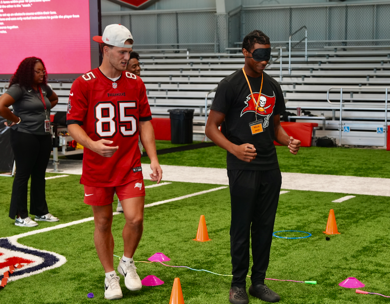 Students and Bucs player at Student-Player Mentoring Program