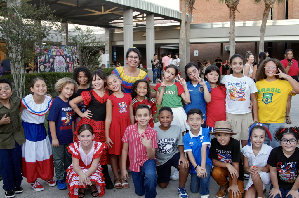 Students and teacher at Hispanic Heritage Month Celebration