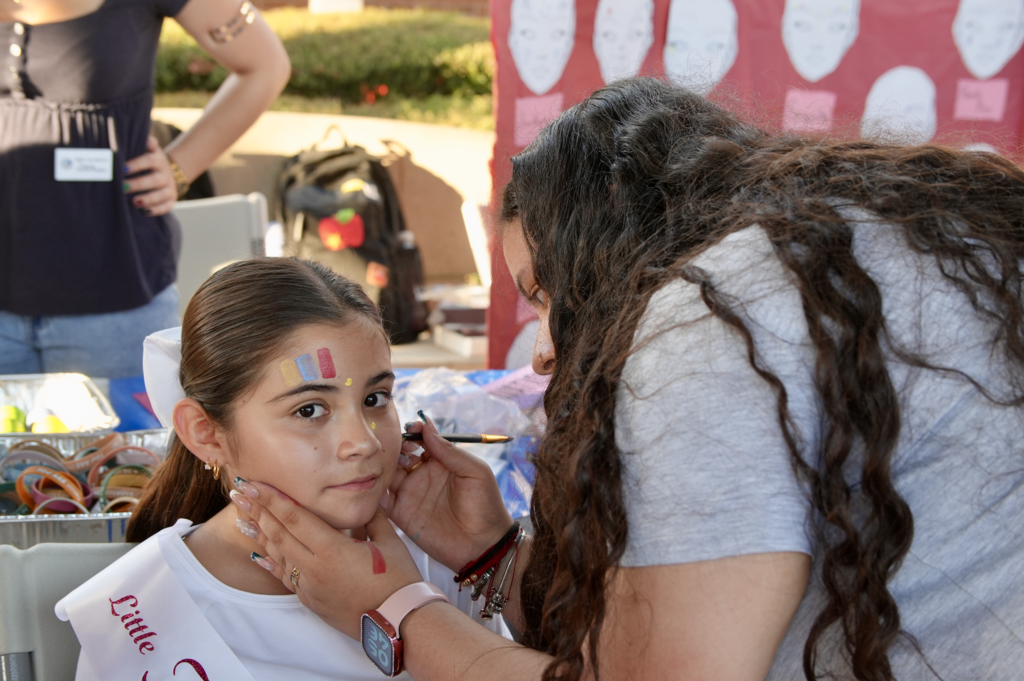 Student getting face painted at Hispanic Heritage Month Celebration