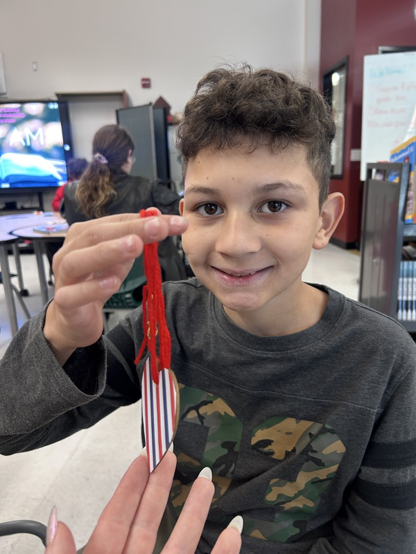 student showcasing his “freedom” bookmark