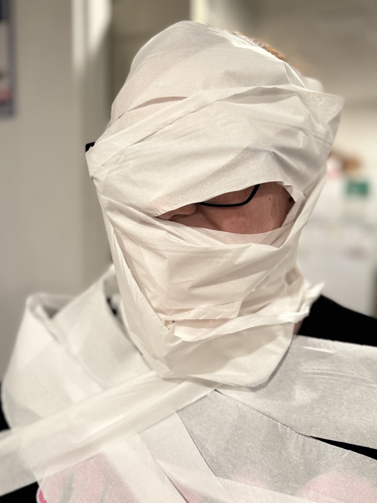 Halloween party games mummy wrap