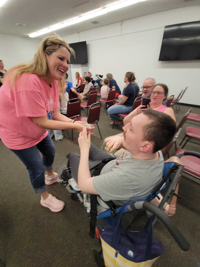 Teacher and Student looking at small animal