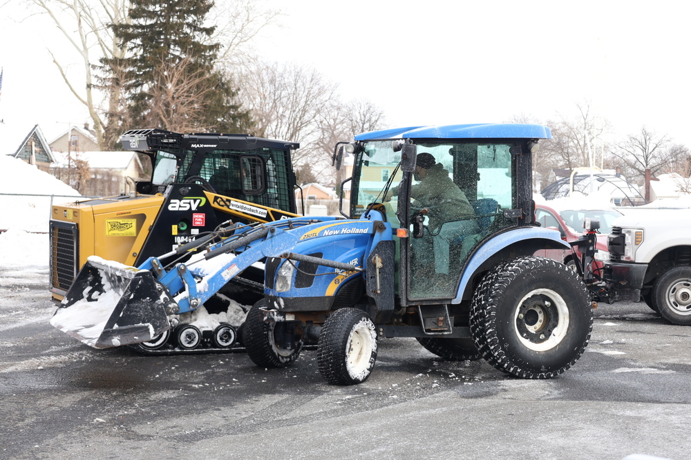 maintenance cleaning up snow