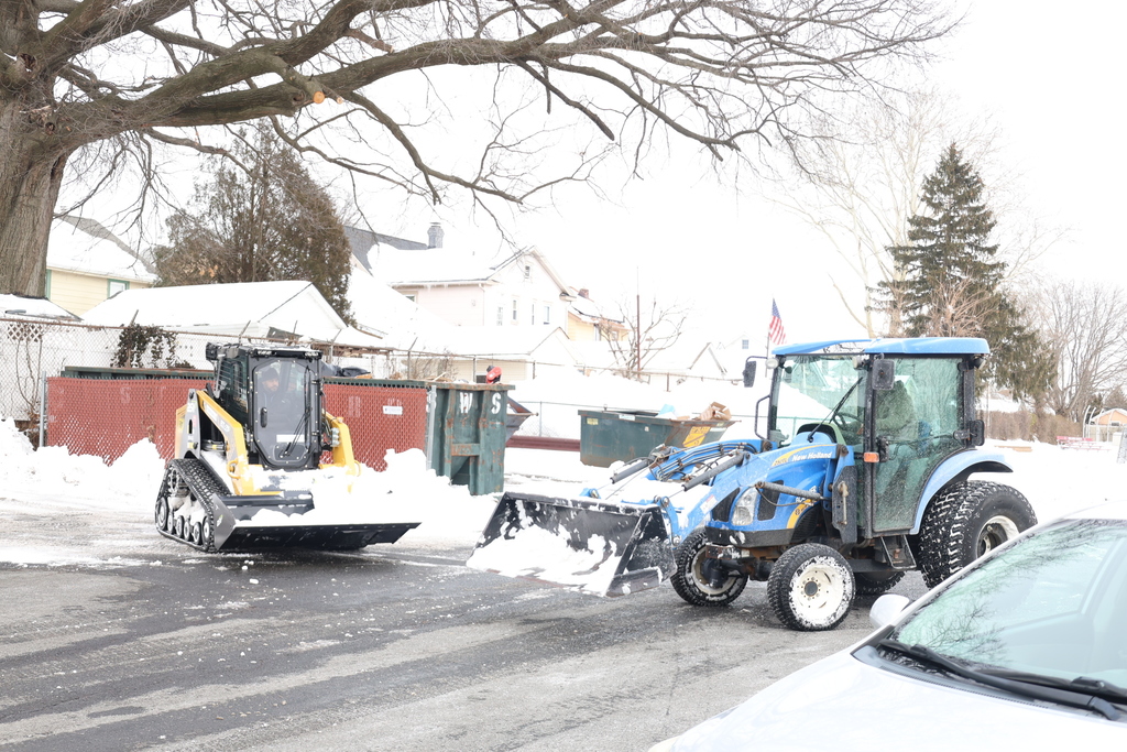 Maintenance cleaning up snow