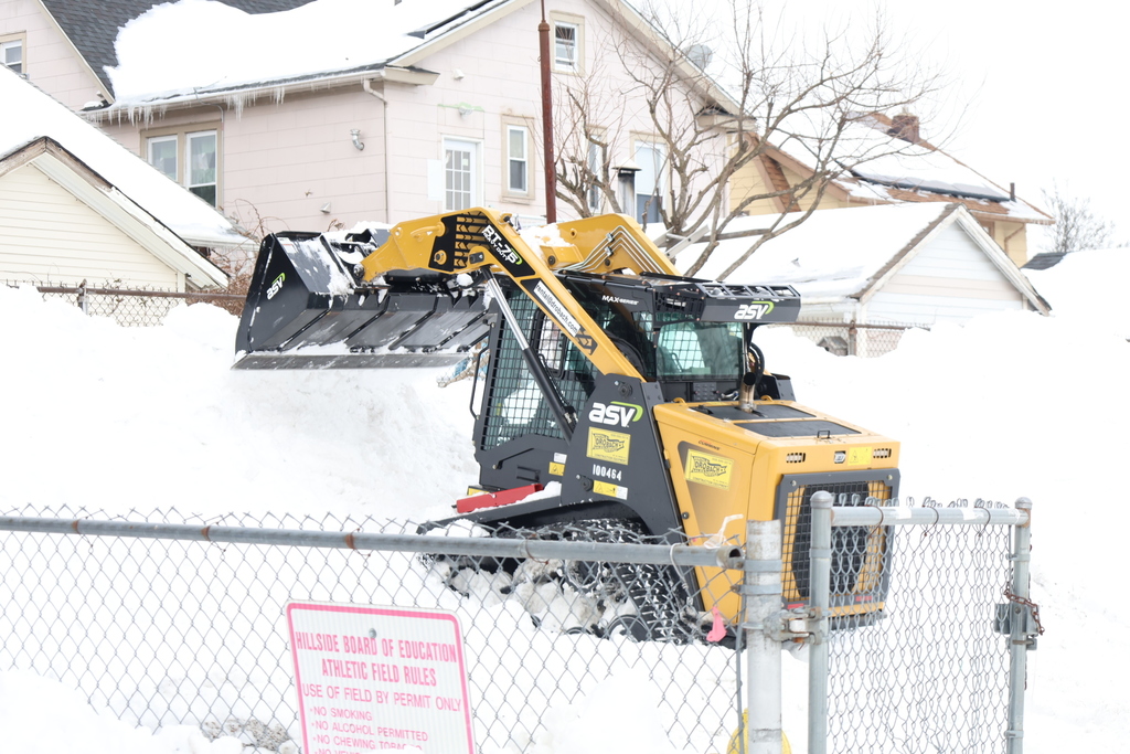 Maintenance cleaning up snow