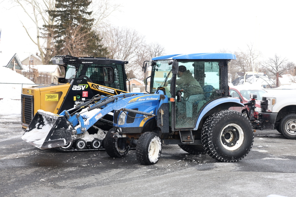Maintenance cleaning up snow