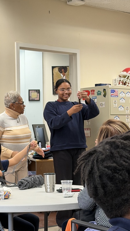 student showing knitting 