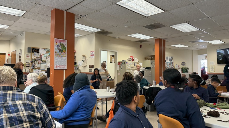 students showing her knitting 