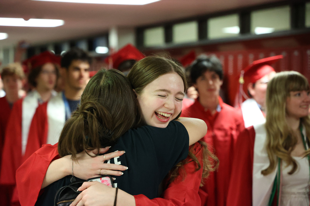 Senior Walk-Girl hugging teacher