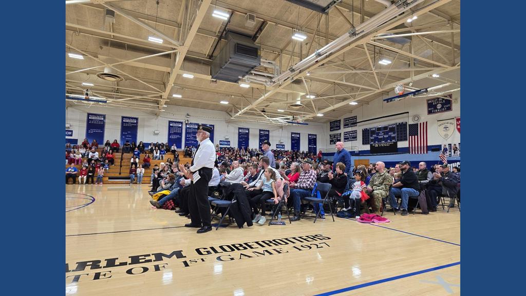 veterans standing for recognition at assembly