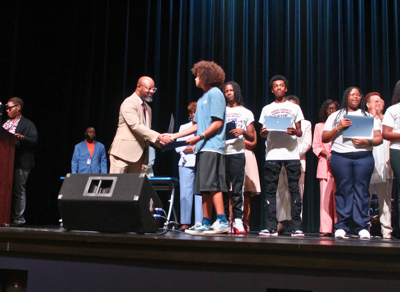 Student receives certificate