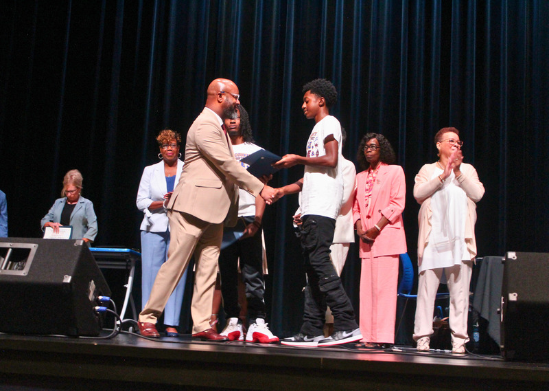 Student receives certificate