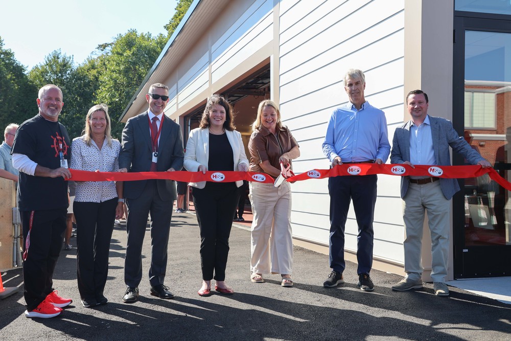 HPS administrators, HSP leaders, and Sen. Oat O'Connor pose during ribbon cutting.