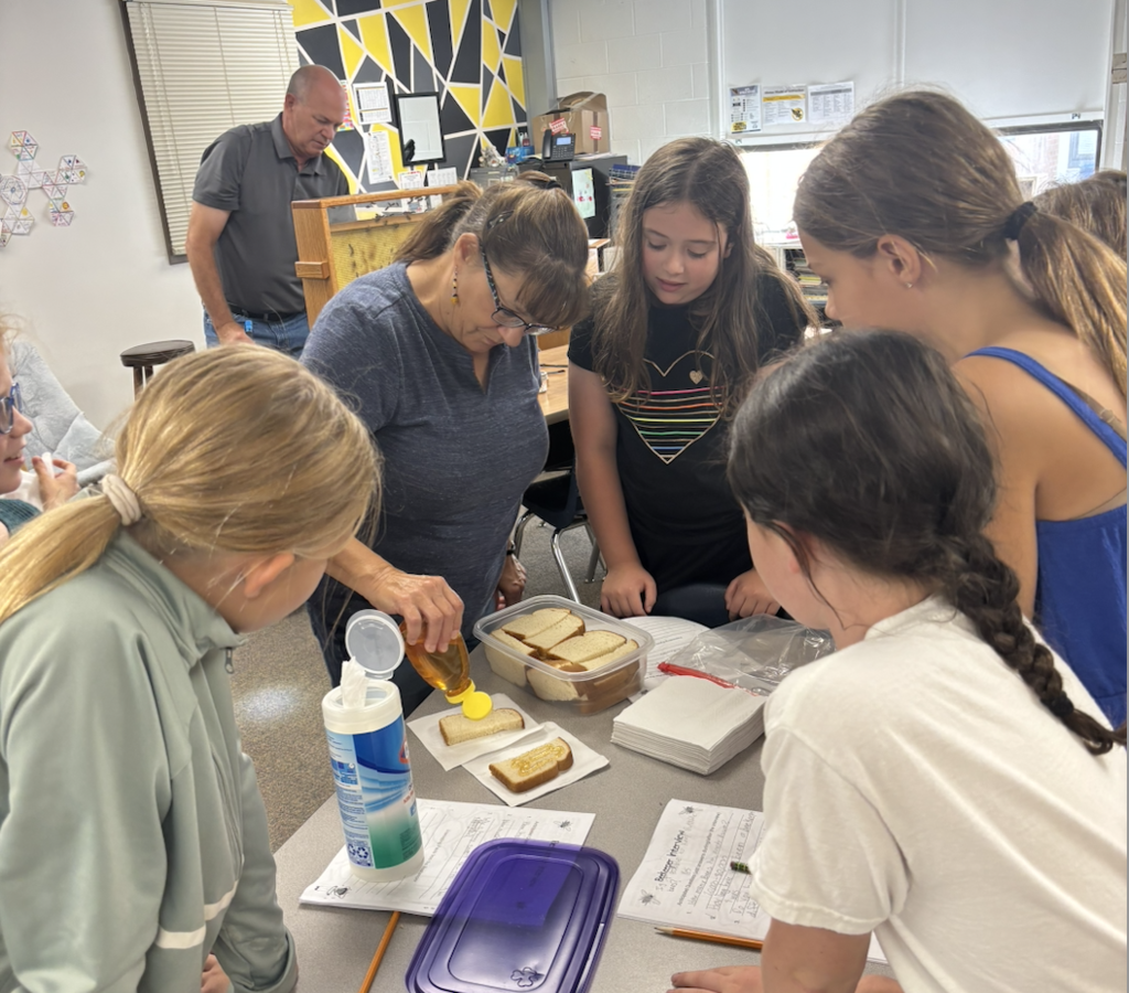 Lenore Field preparing the bread and honey. 