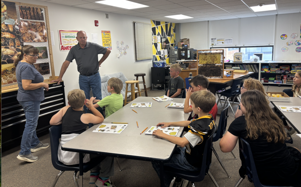 Loren and Lenore Field talking about bees. 