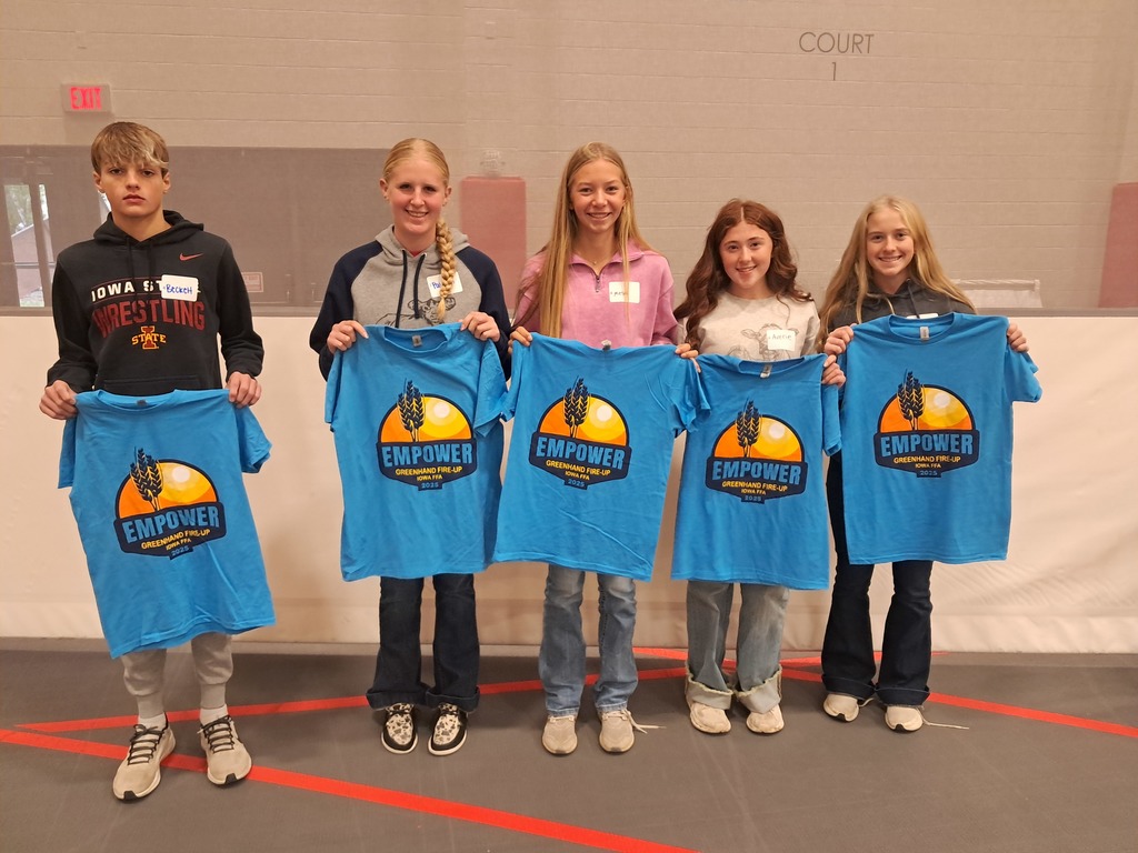 Students posing with their t-shirts
