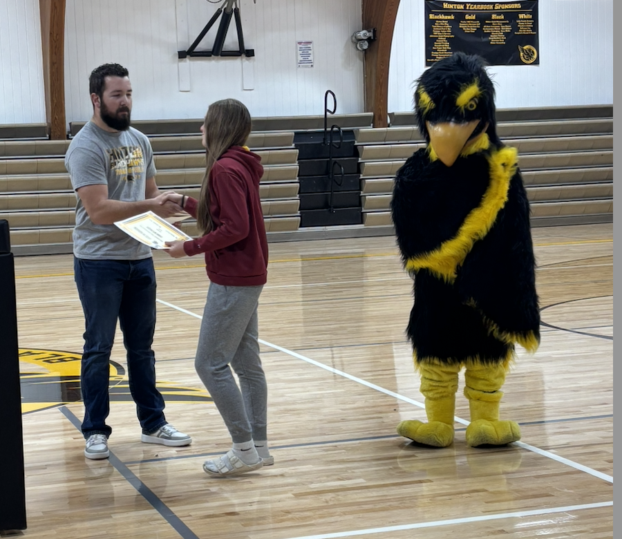 student receiving their award