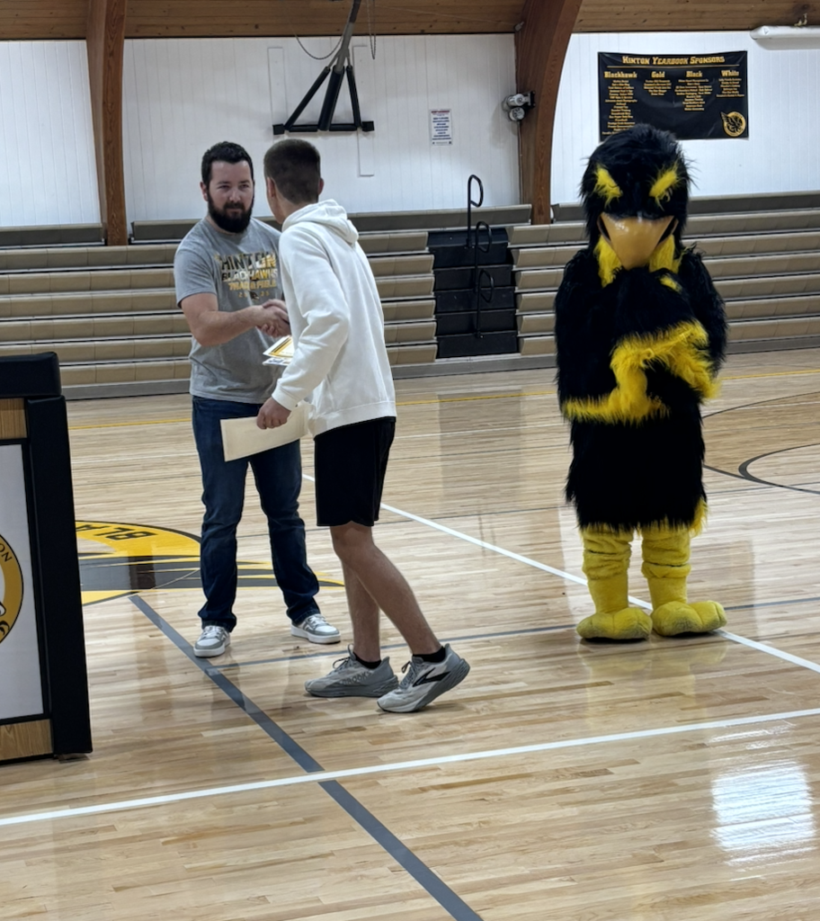 student receiving their award