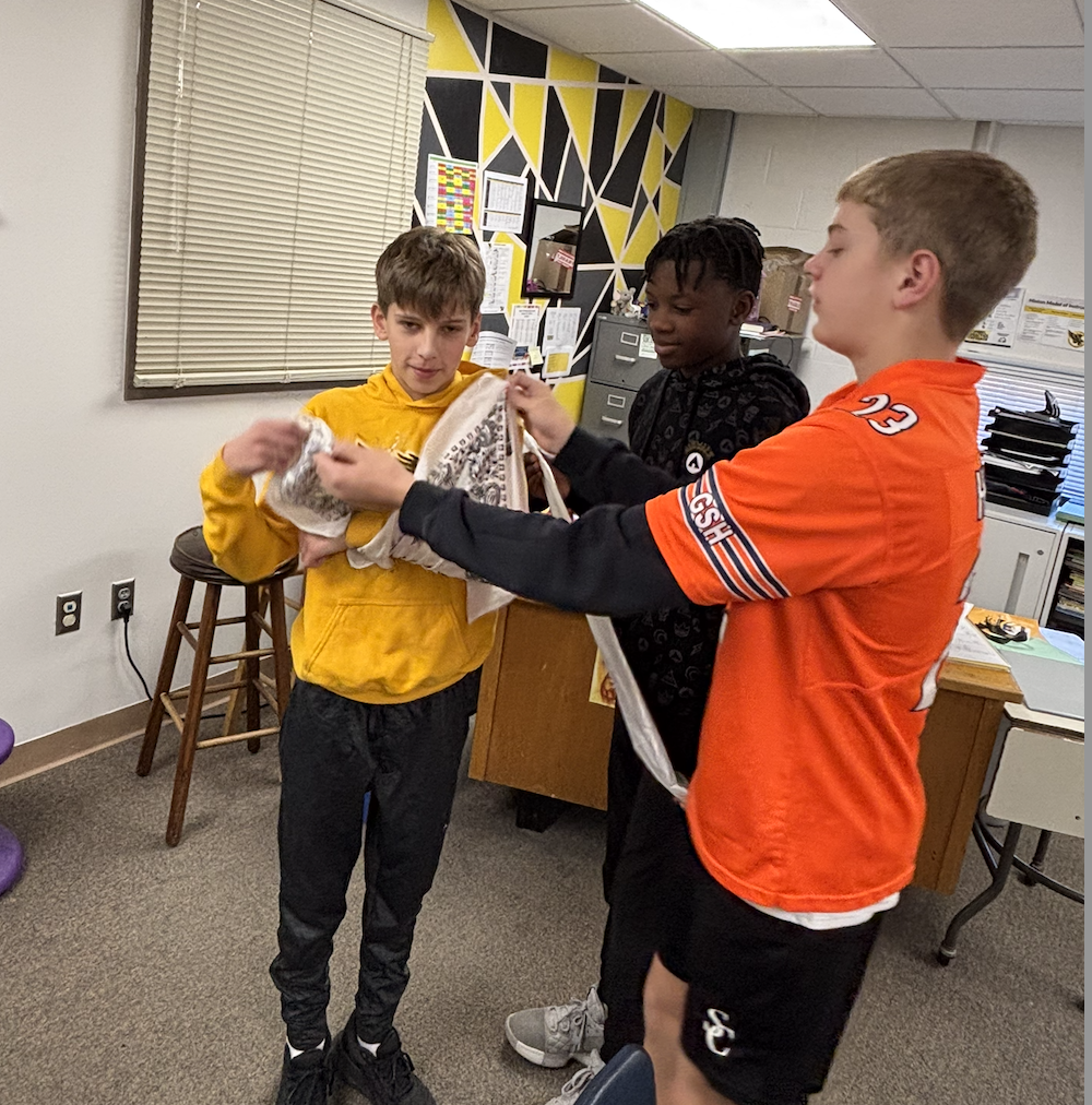 students practicing first aid