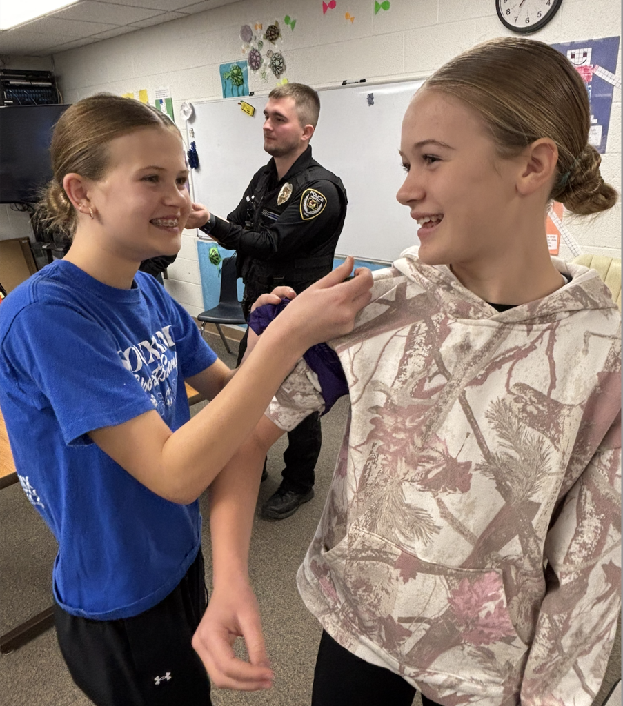 students practicing first aid