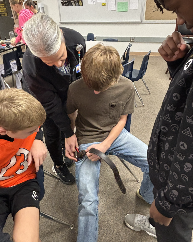 students practicing first aid