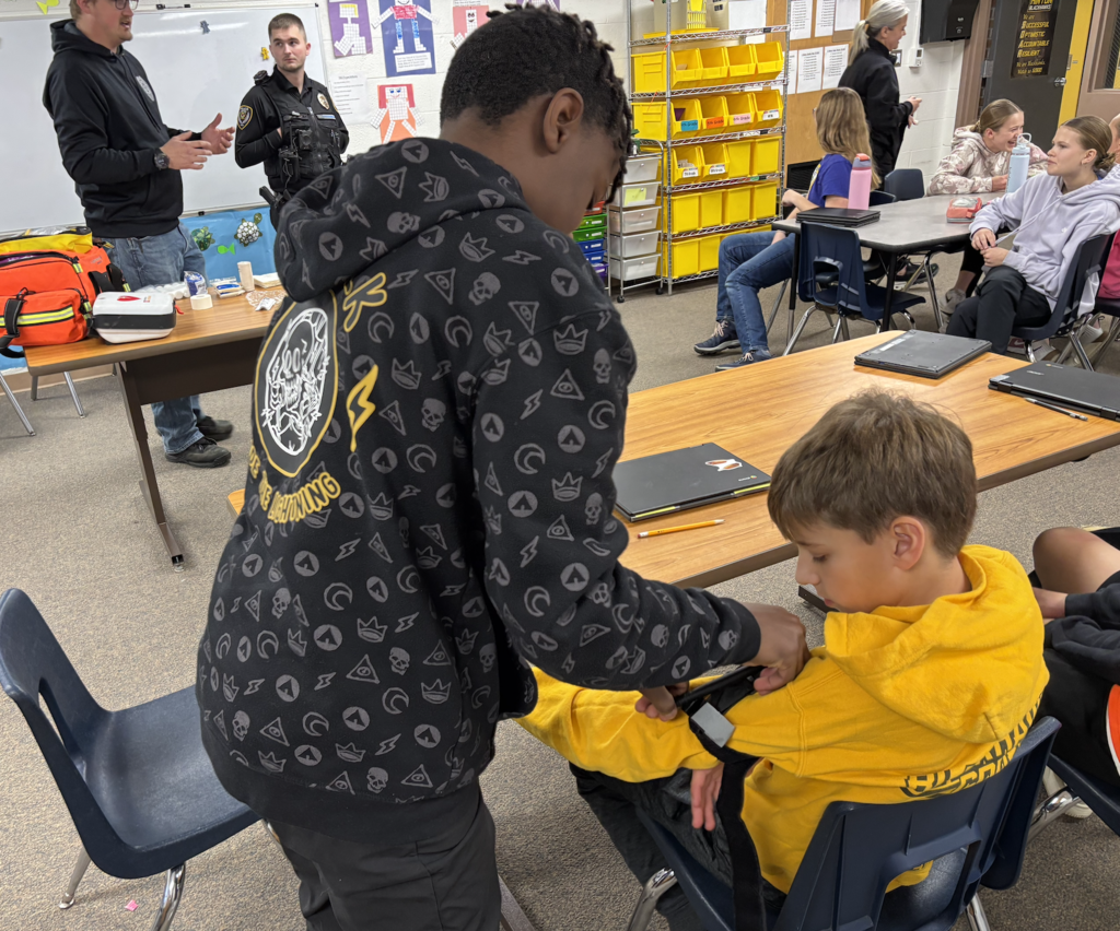 students practicing first aid