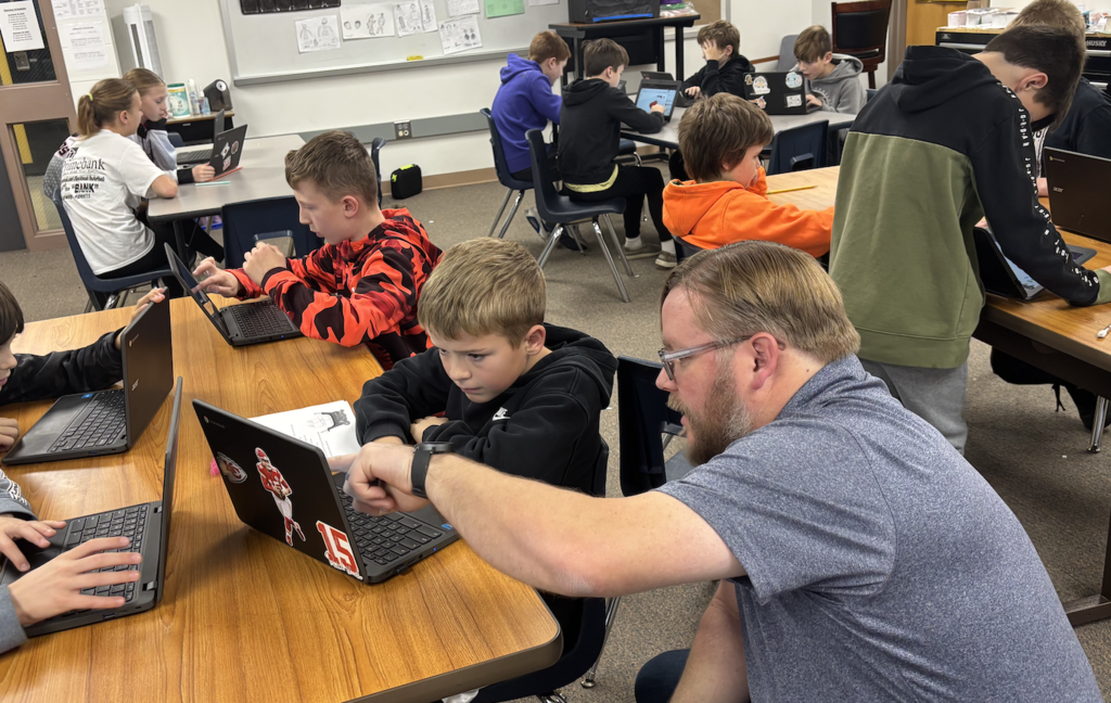 Jacob showing students how to use Tinkercad, a 3D printing software