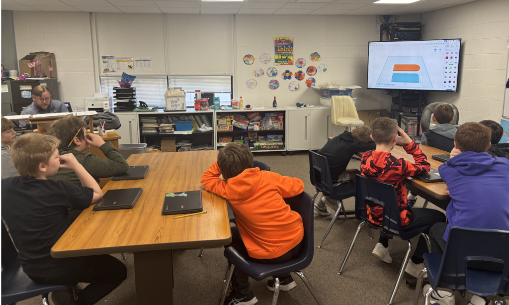 Jacob showing students how to use Tinkercad, a 3D printing software