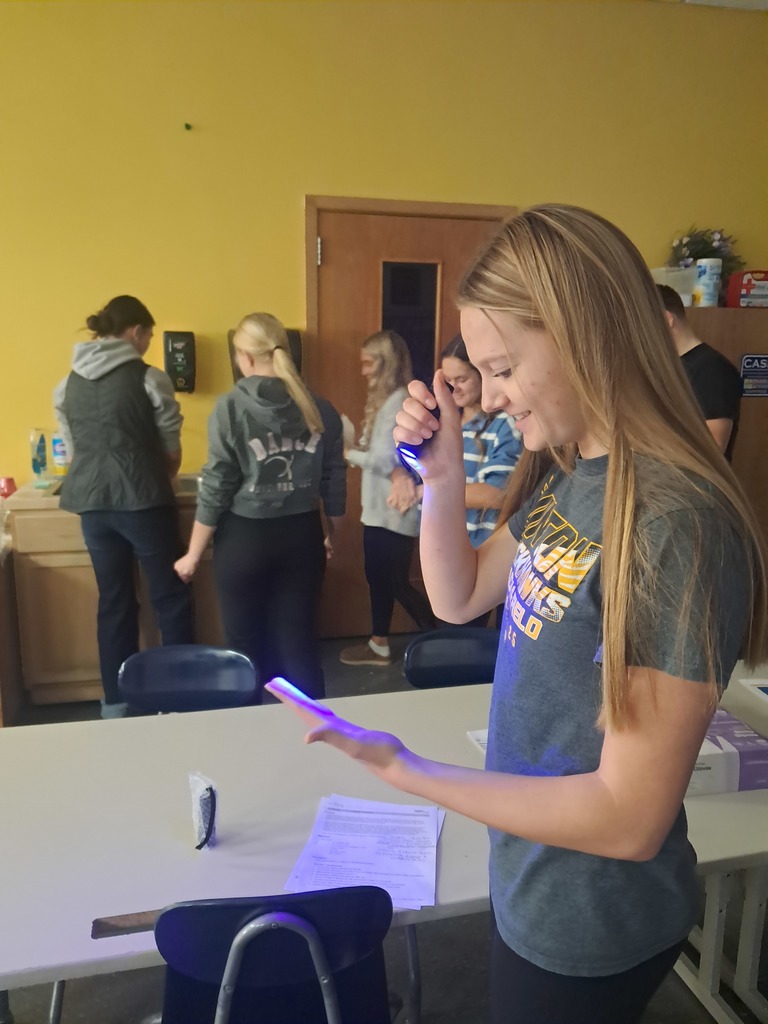 Observing the "germs" on their hands.