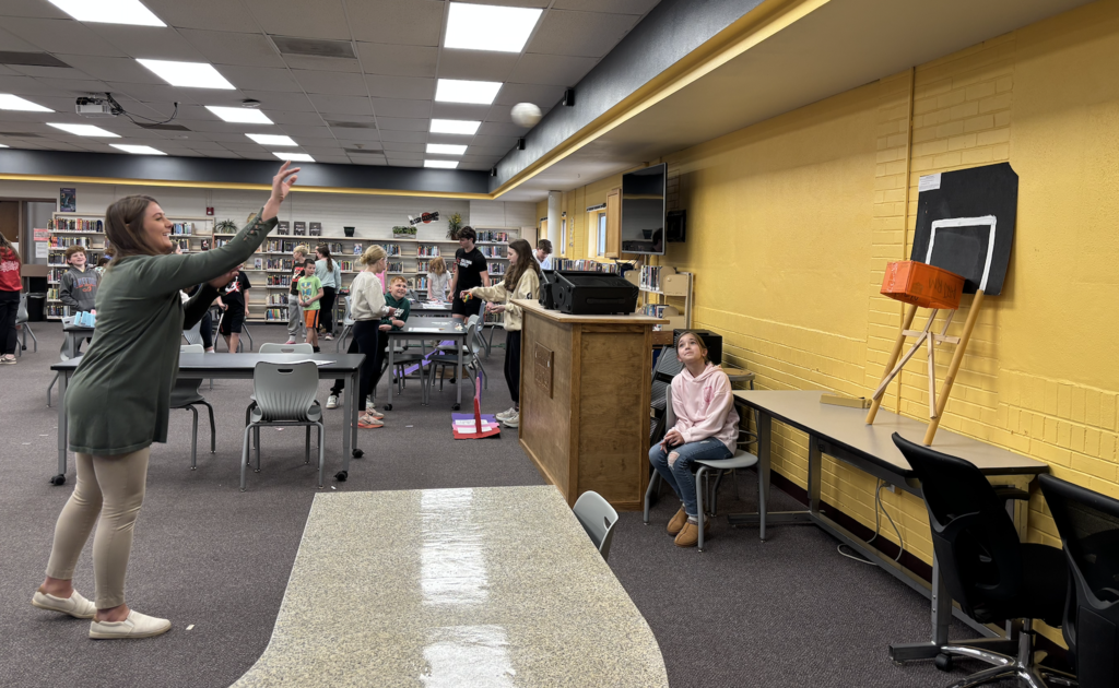 Ms Schoenrock playing Basketball Mayhem