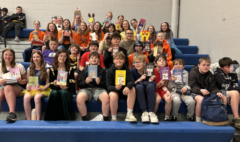 6th grade students with their new books