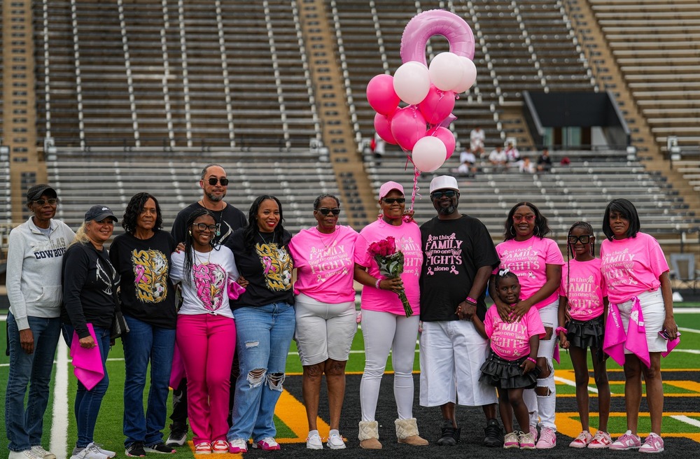 Hobbs Eagle Soccer recognized LuAnn Cox at the Pink Out - Breast Cancer Awarness Game. LuAnn shown with her family and loved ones, wearing pink shirts in support of LuAnn who is battling breast cancer.