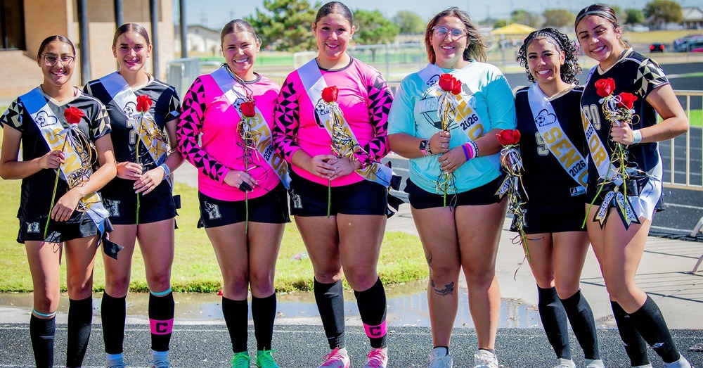 senior soccer girls posing for photo