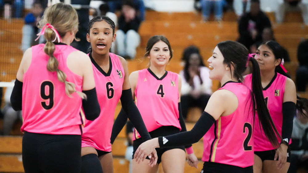 volleyball players celebrating win