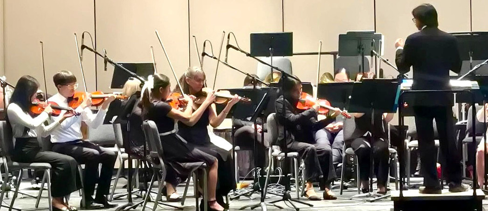 orchestra playing on stage