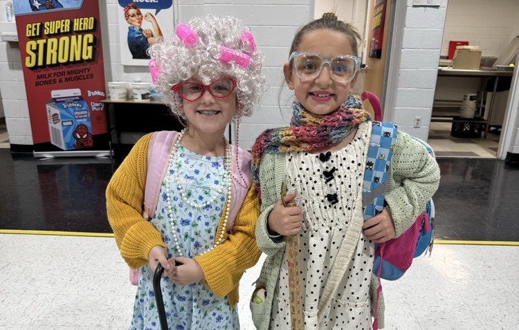 two girls dressed like old ladies