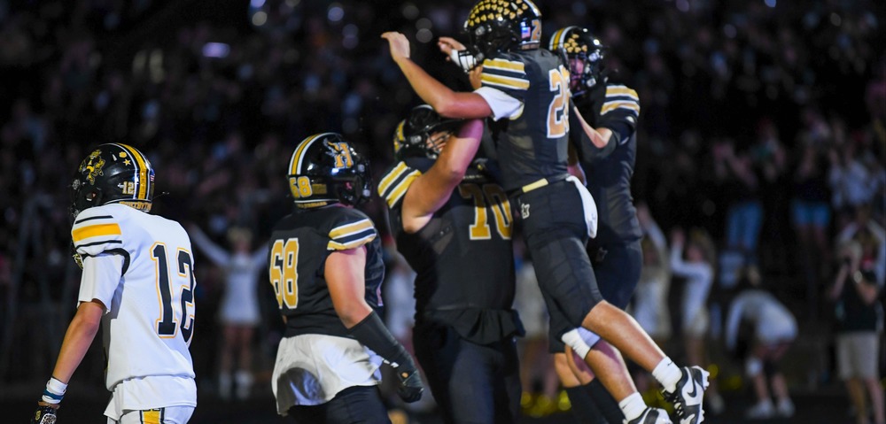 football players celebrating touchdown