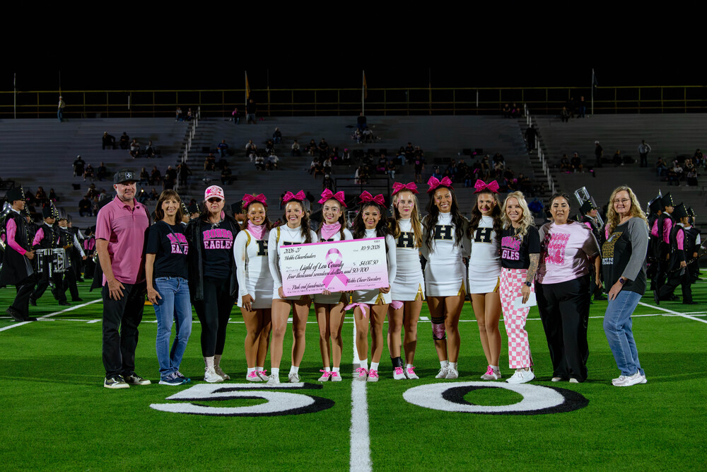 Hobbs Cheer Seniors, present a donation check to Light of Lea County, Nonprofit Organization