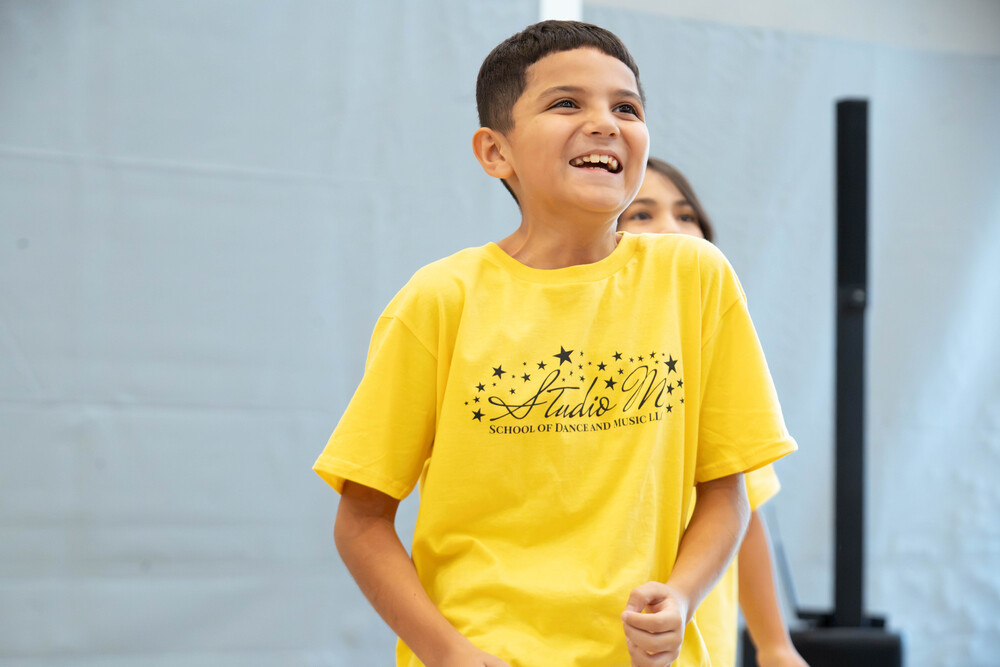 Child enjoying the choreography during the Studio M Dance Residency at Southern Heights Elementary. 