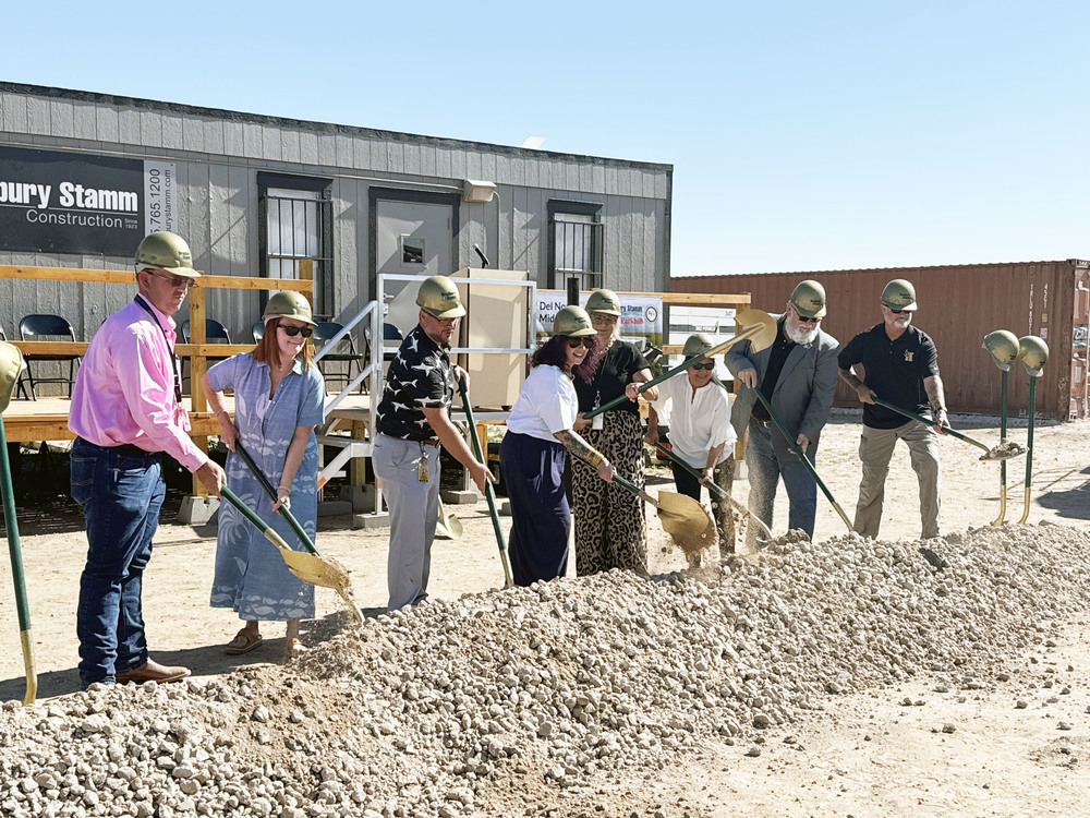 FACT committee members shoveling dirt at groundbreaking