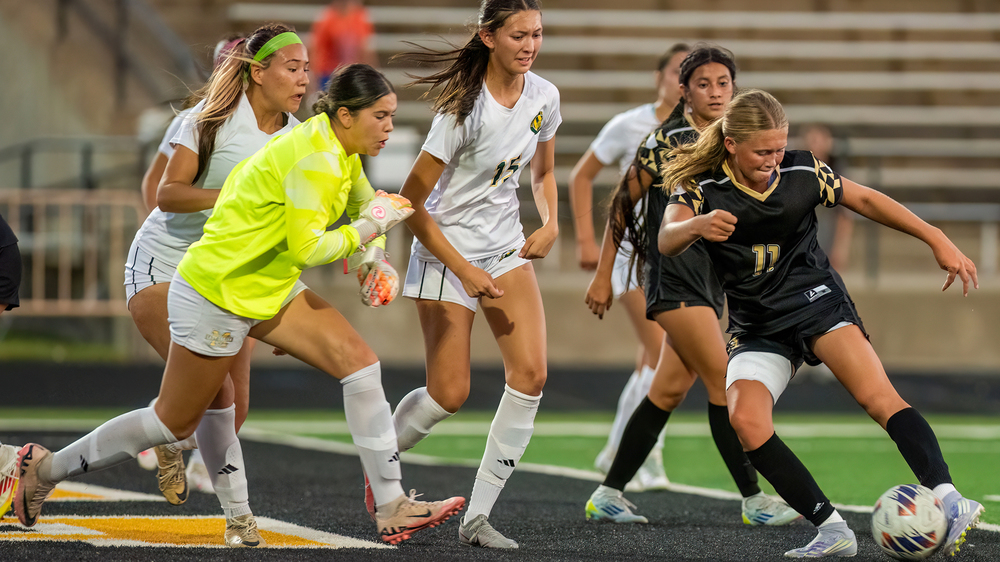 girls playing soccer