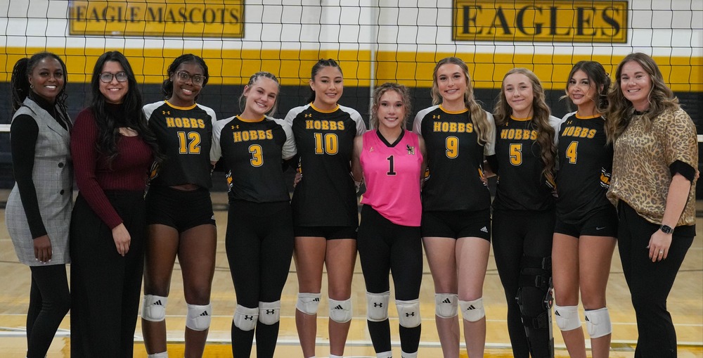 senior volleyball players with coaches