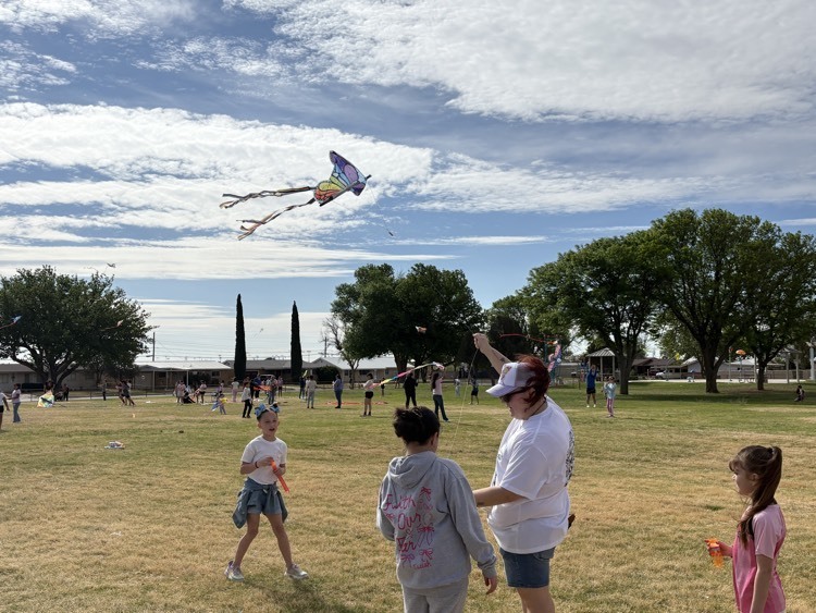 teacher helping kids with lite