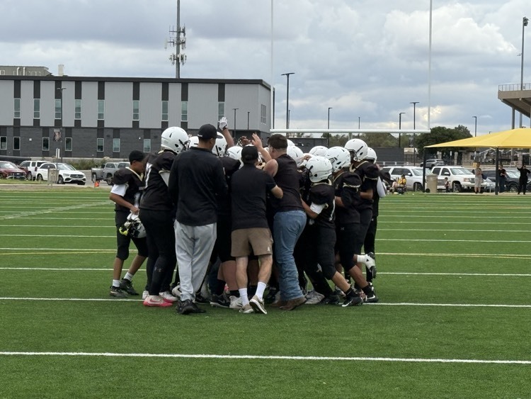 football boys celebrate after their win 