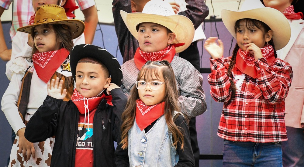 kids in cowboy costumes
