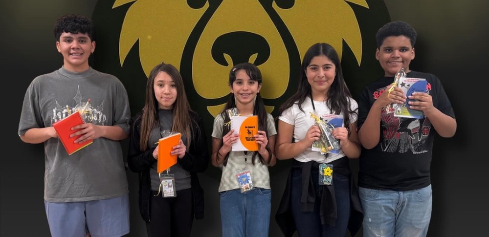 students in front of mural