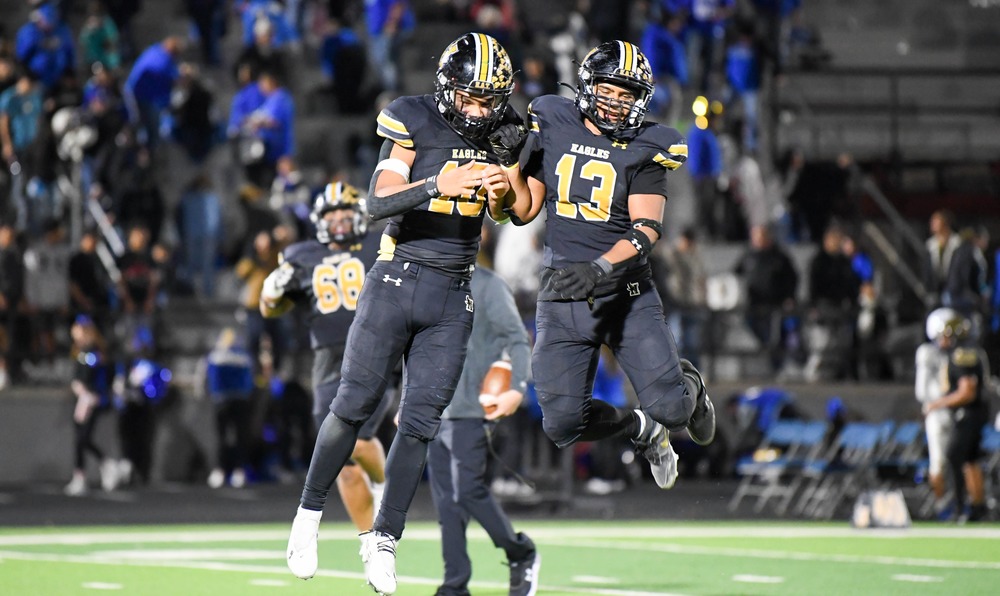 two players leaping on field