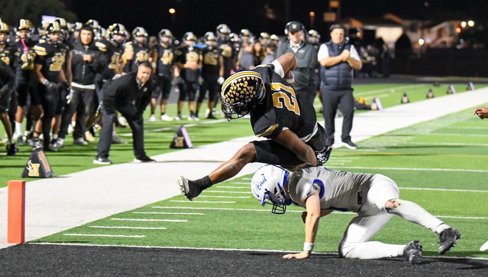football player tackling another player